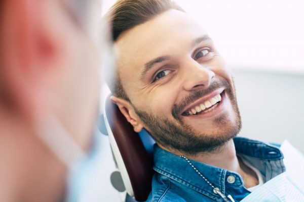 A perfect result of a dentist’s work which is seen in the beautiful and white smile on a patient who is absolutely satisfied with a result of a treatment given in a clinic.